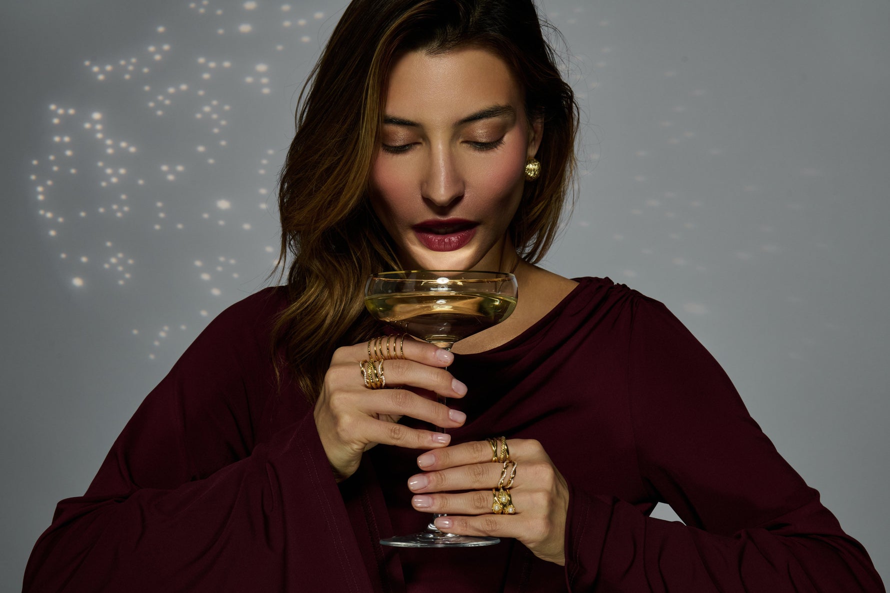 woman wearing layered gold rings elegant styling UK