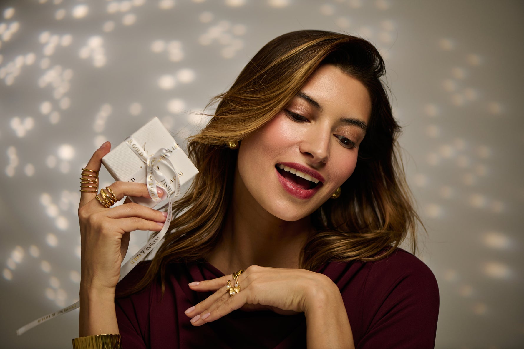 woman holding luxury jewellery gift box gold jewellery UK