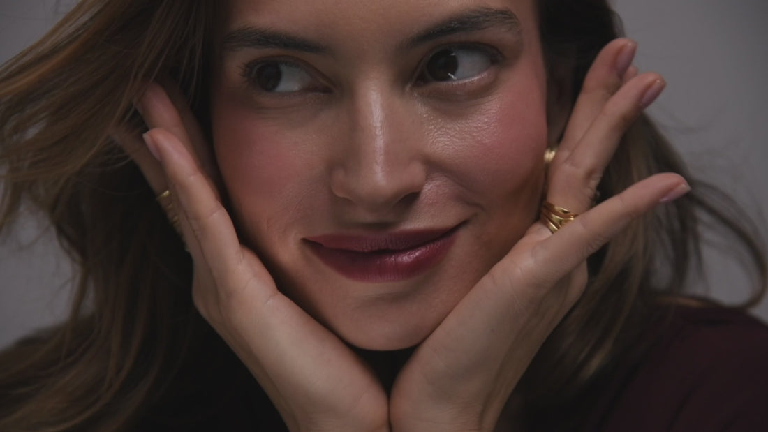 women with golden jewellery happy